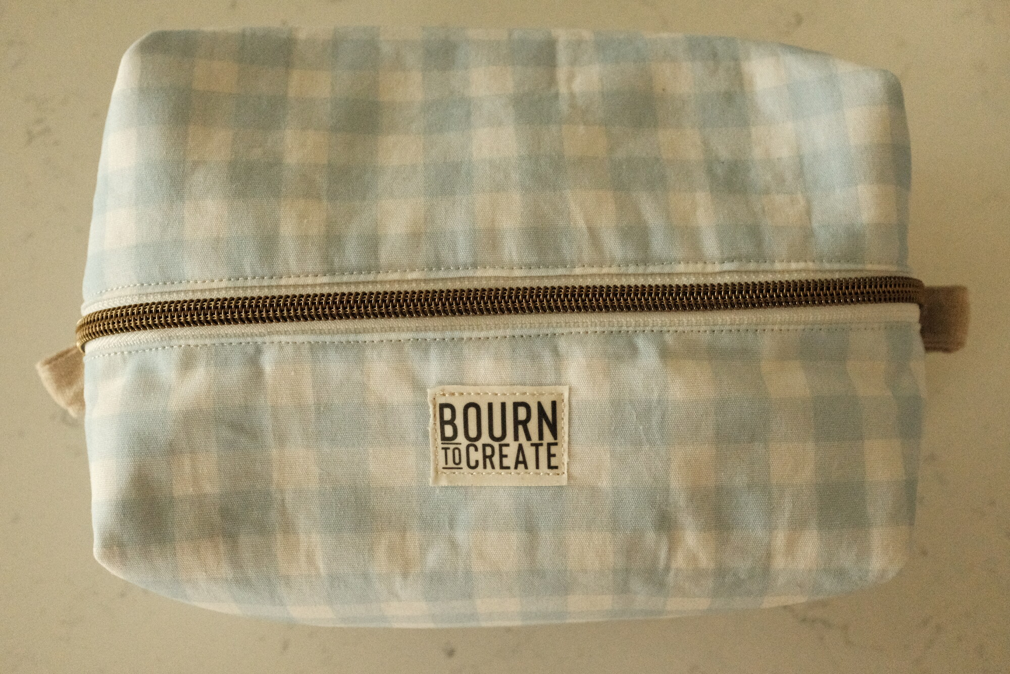 Boxy zip makeup bag in blue-and-white gingham